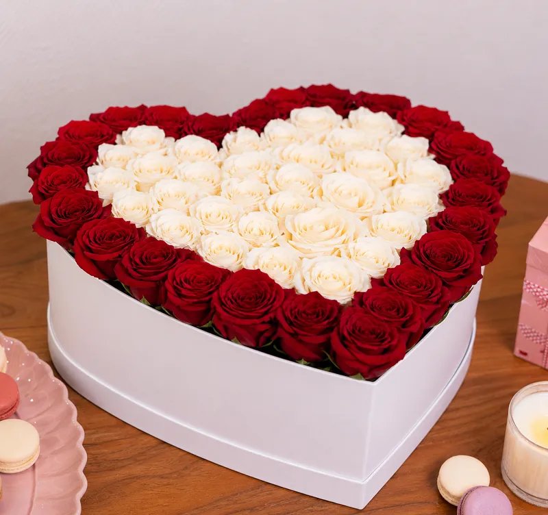 Luxury Rose Box — red and white roses arranged in a heart-shaped box