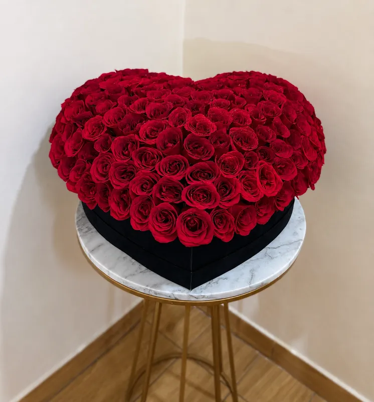 3D Heart Rose Box — vibrant red roses styled into a heart shape in a black velvet gift box
